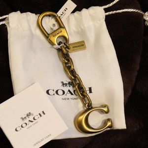 Coach "C" logo gold/brass bag charm key chain NWT and dustbag